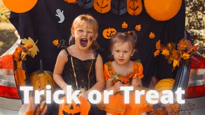"image of girl in costume at Halloween event that says, "Trick or Treat""